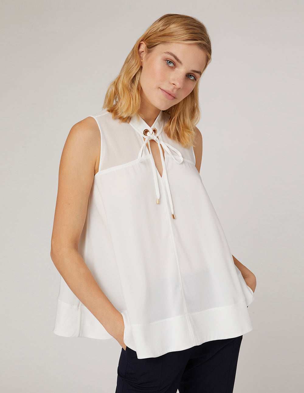 MARYLING White neckline sleeveless loose A-shaped hem top
